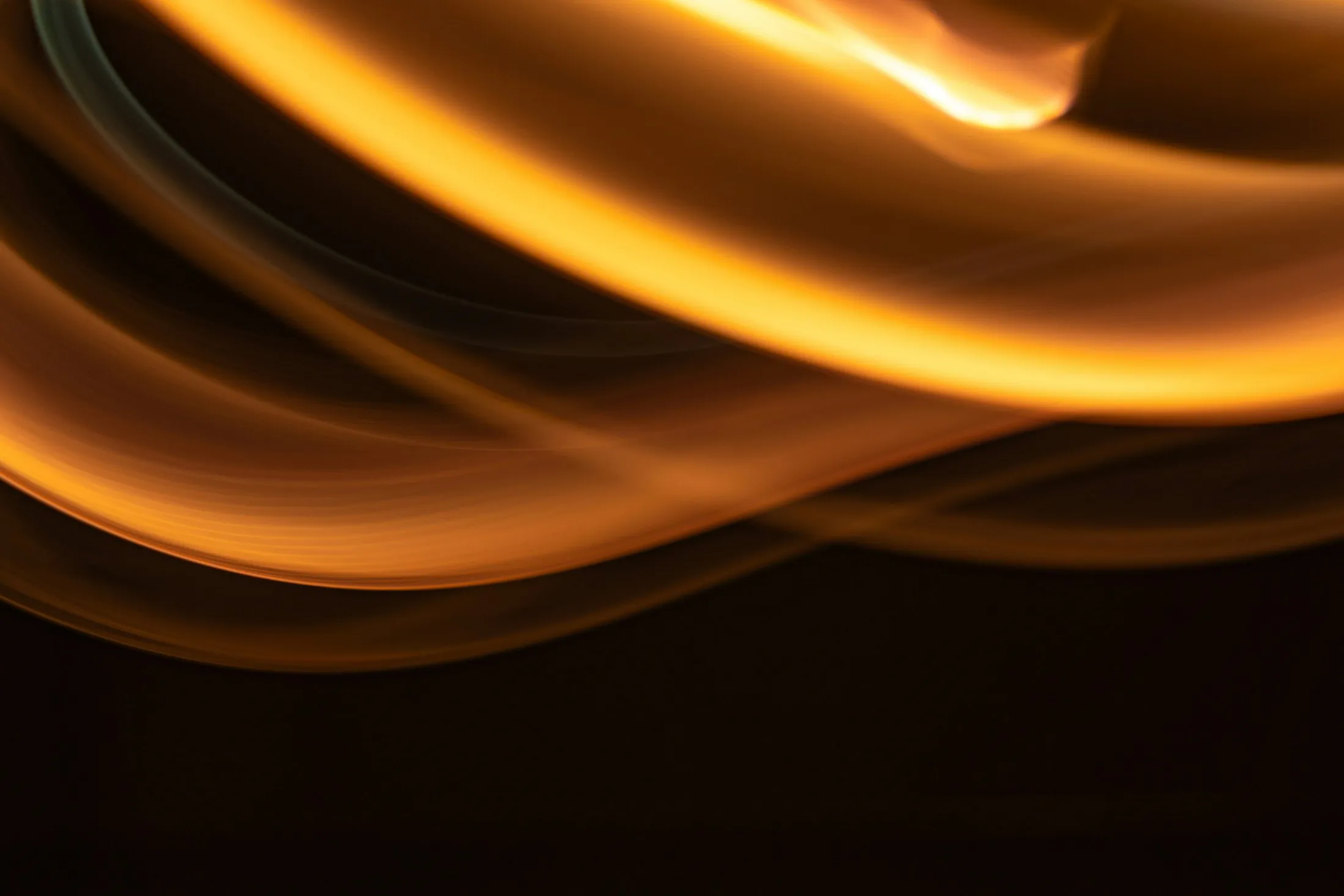 Amber light curving through darkness