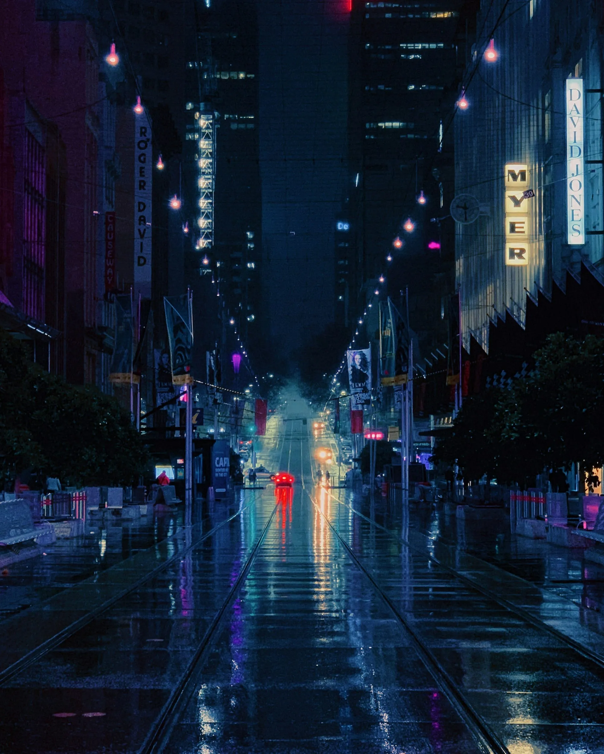 A rain-wet Melbourne street at night