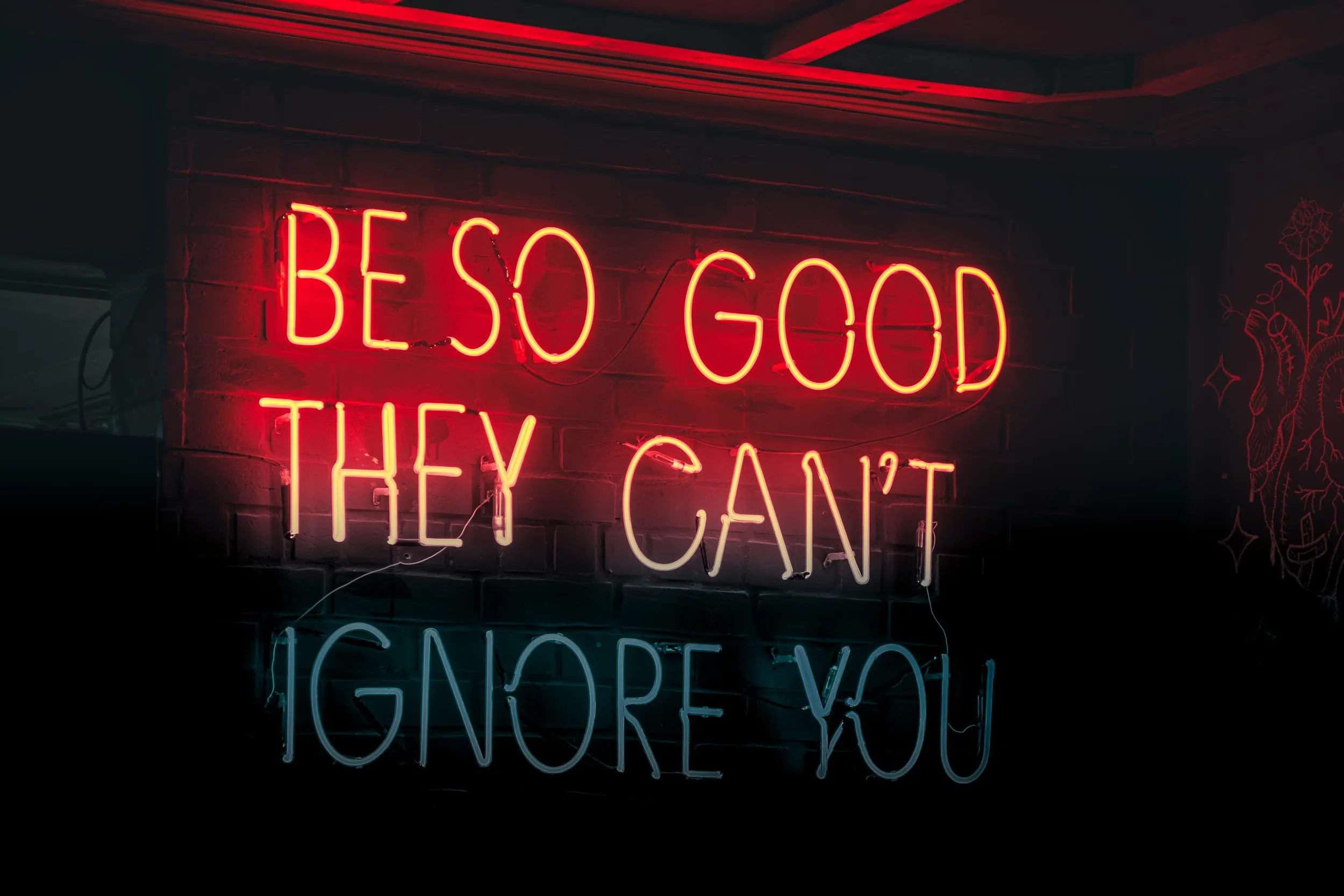 A neon sign at night, a message meeting someone already looking