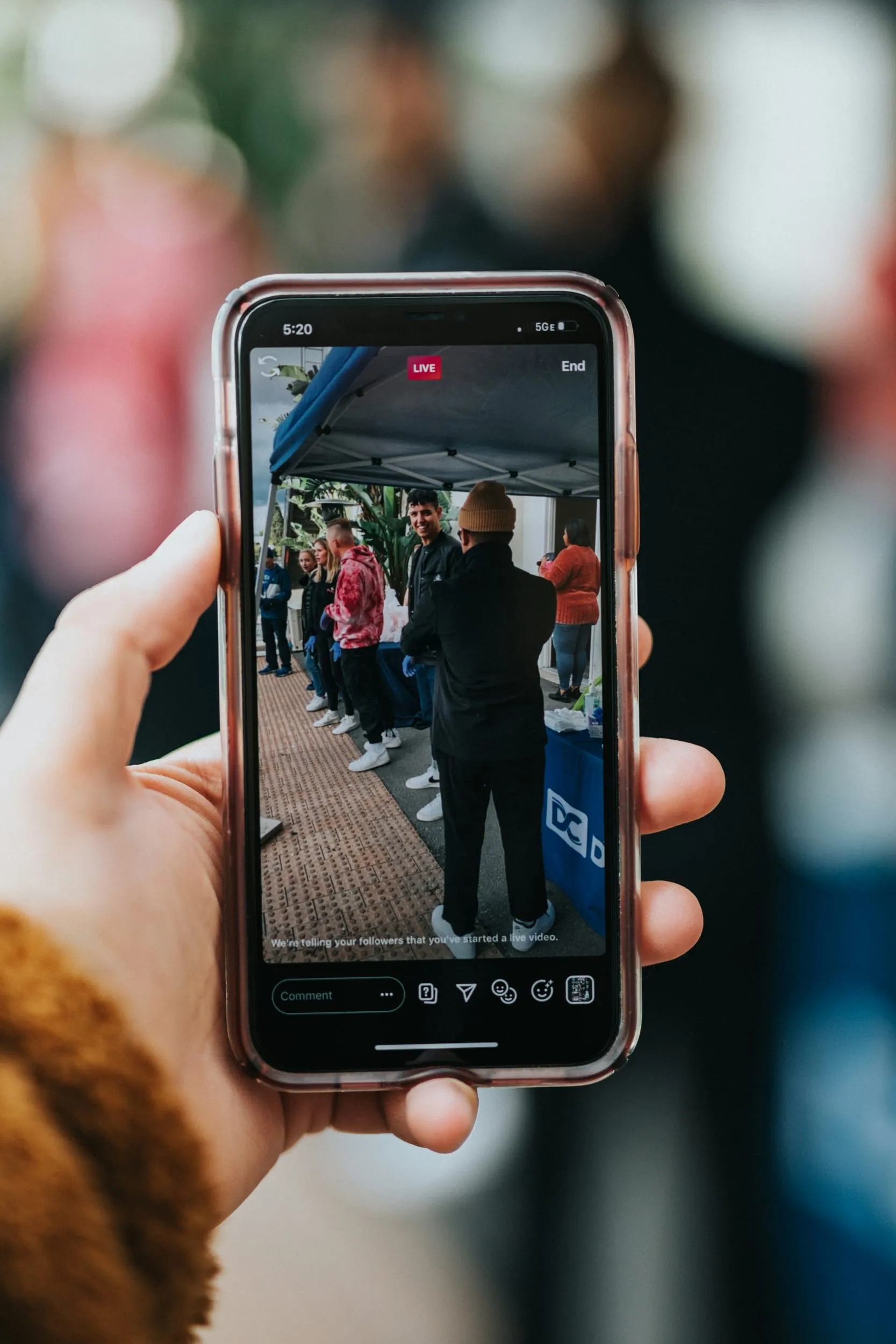 A phone held up in a crowd